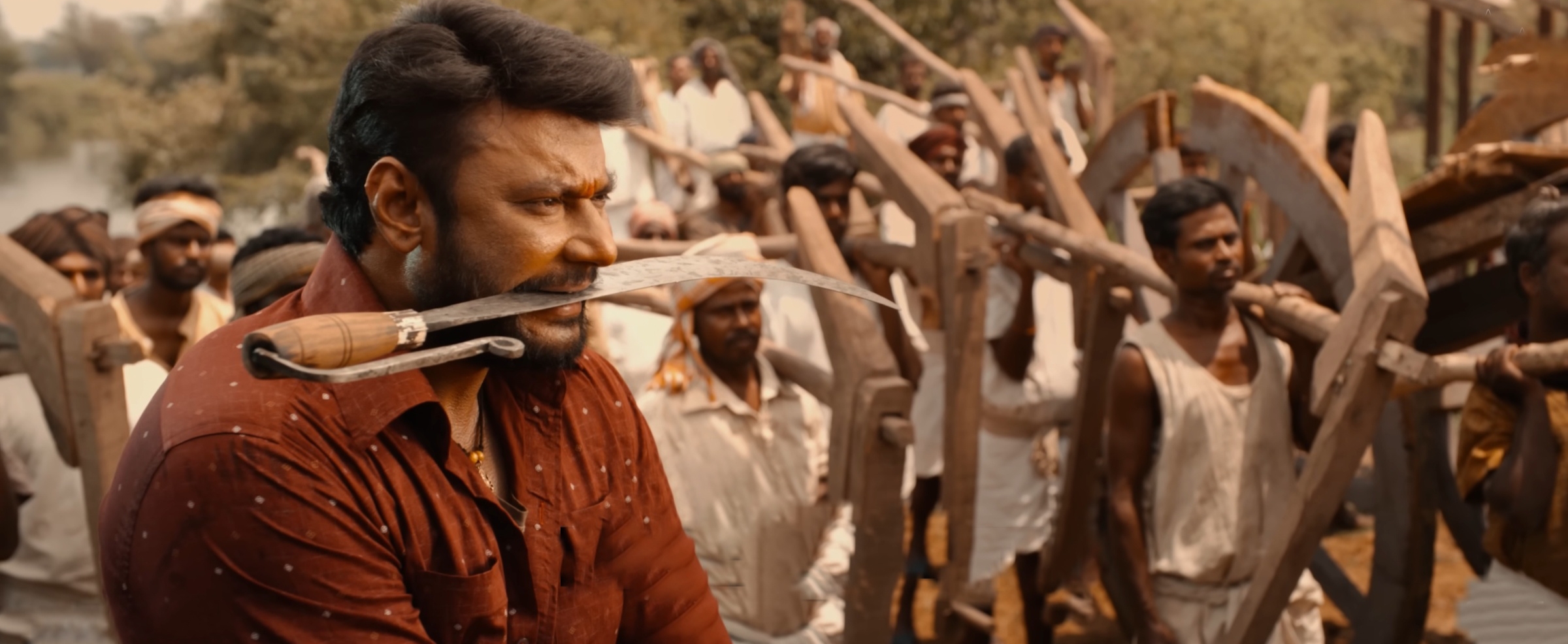 Darshan in ‘Kaatera’. | Photo Credit: Anand Audio/YouTube.
